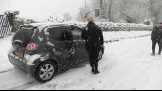 Cars slipping, sliding and crashing in heavy snow in Gloucestershire